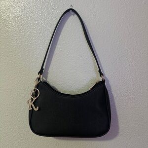Elegant Black Handbag with Charm